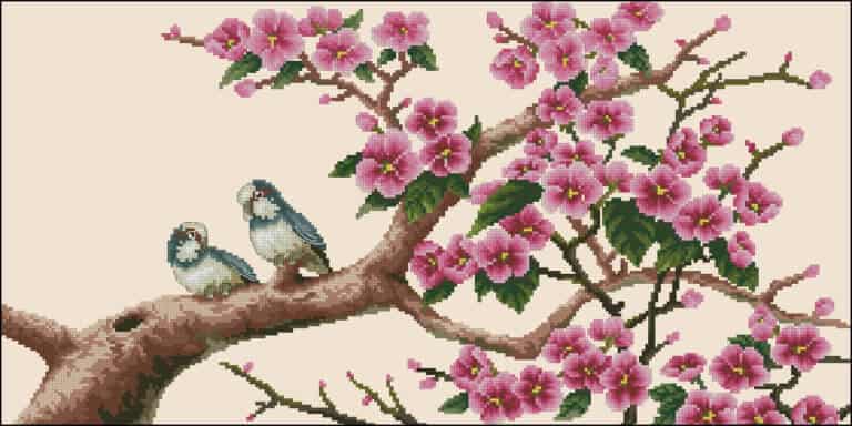 Two birds on a blossom branch-free cross-stitch pattern